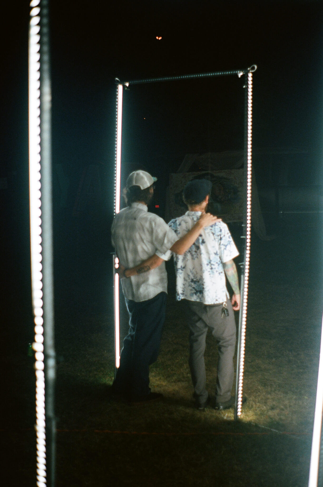Eli Kahn and Arthur Schroeder inside GIIIVENS’ light sculpture.