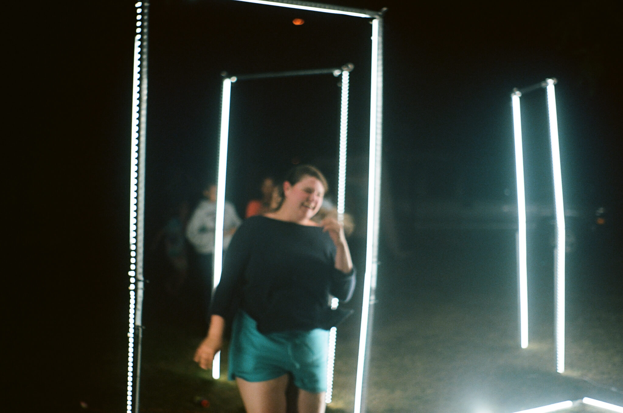 Kyra McAndrews running inside GIIIVENS’ light sculpture.