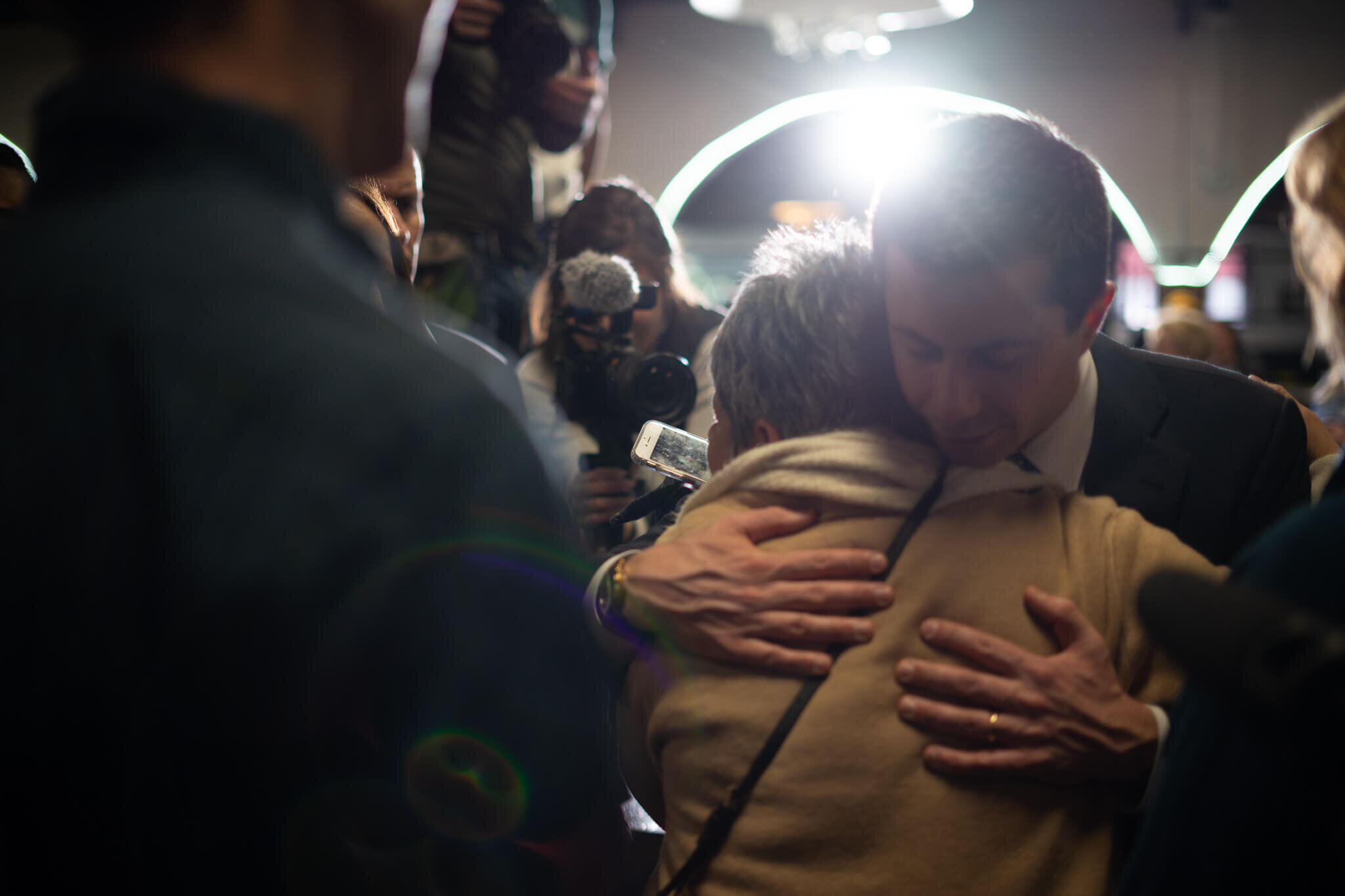 Mayor Pete hugs a caucus-goer after a lengthy rope line conversation.