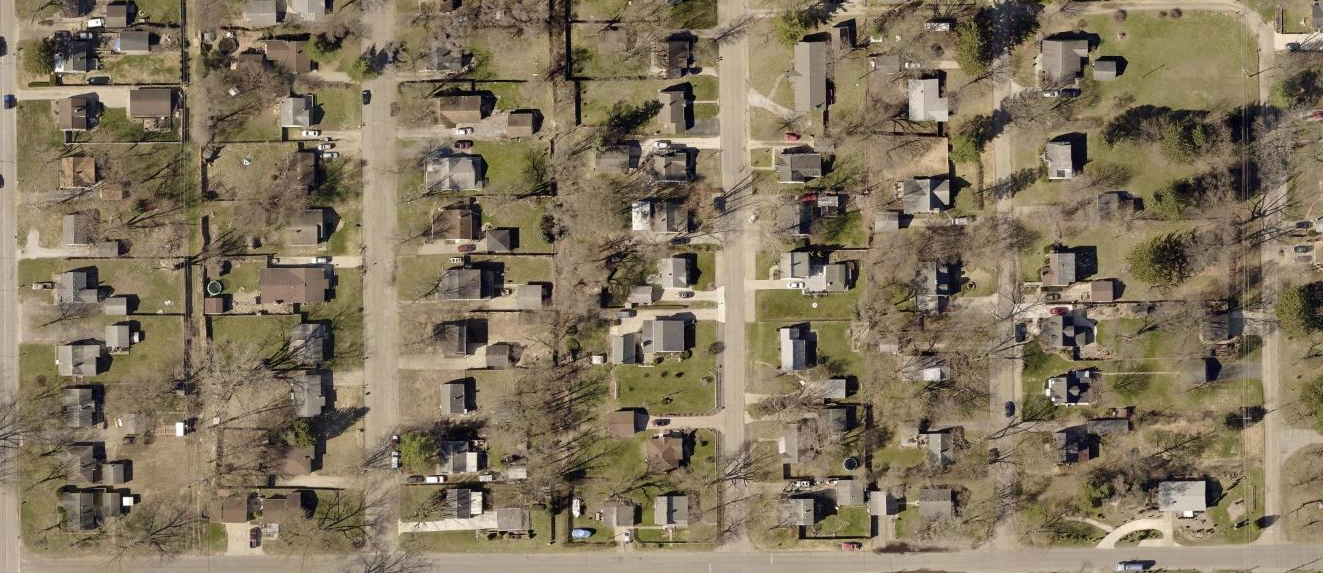 Typical 1940s and 1950s neighborhood in unincorporated Clay Township. Notice the lack of sidewalks and other typical public amenities found in city neighborhoods. This was cheaper for developers.